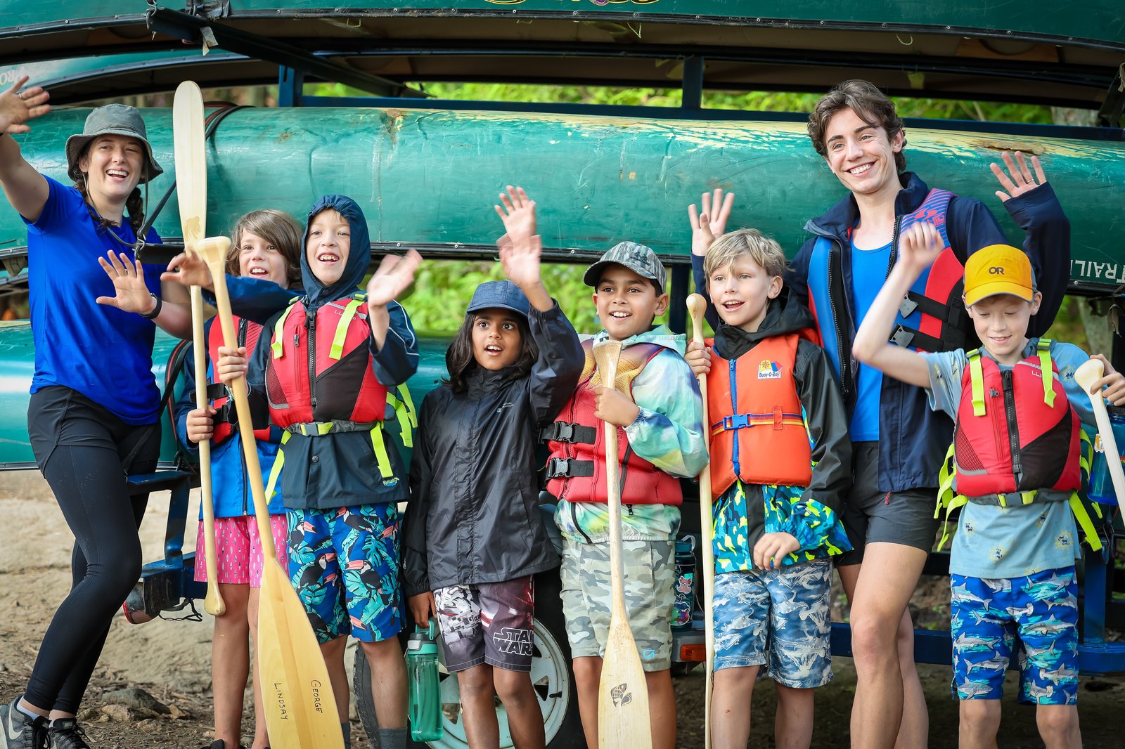Campers with paddles and life jackets ready to head out on the water